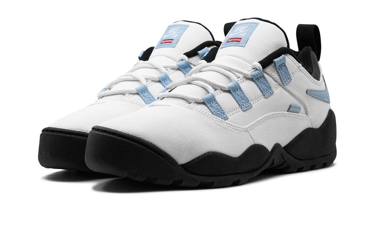 Supreme x Nike SB Darwin Low Sneakers – White, Light Blue & Black with Reverse Swooshes