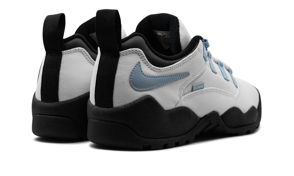 Supreme x Nike SB Darwin Low Sneakers – White, Light Blue & Black with Reverse Swooshes