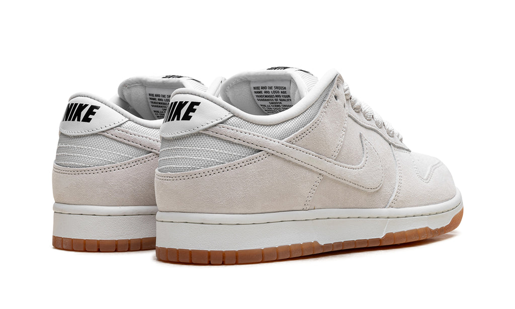 Nike SB Dunk Low Pro B Sneakers - Light Gray & Off-White with Gum Sole